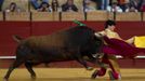 Spanish matador Fernandez performs a pass during a bullfight in Seville