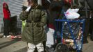 People wait outside a grocery store damaged by Hurricane Sandy to receive food and other supplies in the Rockaways section of the Queens borough of New York November 1, 2012. New York power company Consolidated Edison Inc said Thursday it still had about 659,400 homes and businesses without power three days after monster storm Sandy slammed into the U.S. East Coast. REUTERS/Shannon Stapleton (UNITED STATES - Tags: ENVIRONMENT DISASTER) Published: Lis. 1, 2012, 4:03 odp.