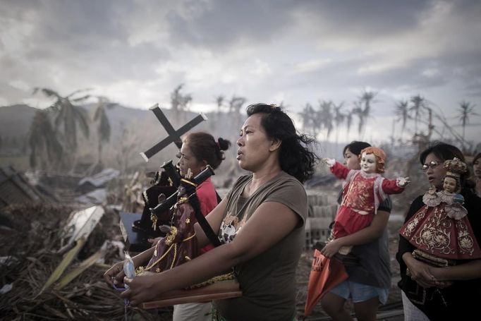 Phillipe Lopez, a French photographer working for Agence France-Presse, won the 1st Prize Spot News Single category of the 2014 World Press Photo contest with this picture of survivors of typhoon Haiyan marching during a religious procession in Tolosa, Philippines, taken November 18, 2013. The prize-winning entries of the World Press Photo Contest 2014, the world's largest annual press photography contest, were announced February 14, 2014.