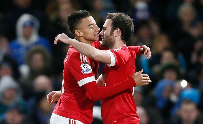 Manchester United's Jesse Lingard celebrates scoring their first goal with Juan Mata