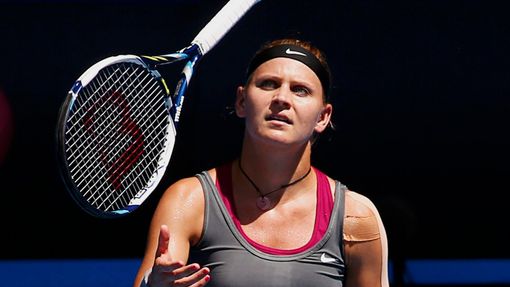 Lucie Safarova of the Czech Republic throws her racquet  up in the air during her women's singles match against Li Na of China at the Australian Open 2014 tennis tourname
