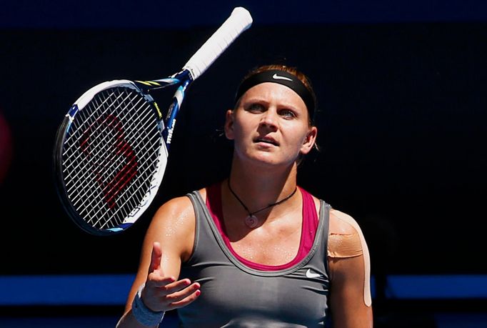 Lucie Safarova of the Czech Republic throws her racquet  up in the air during her women's singles match against Li Na of China at the Australian Open 2014 tennis tourname