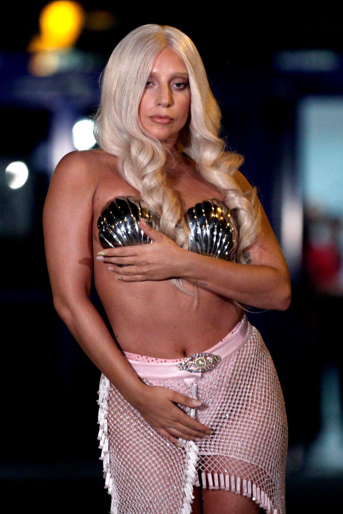 Singer Lady Gaga poses for the media upon her arrival at the Athens' Eleftherios Venizelos airport