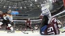 Germany's Marcel Noebels (L) scores past Latvia's goalie Kristers Gudlevskis (R) during the first period of their men's ice hockey World Championship group B game at Mins