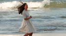 Catherine, Britain's Duchess of Cambridge, runs across Manly beach in Sydney