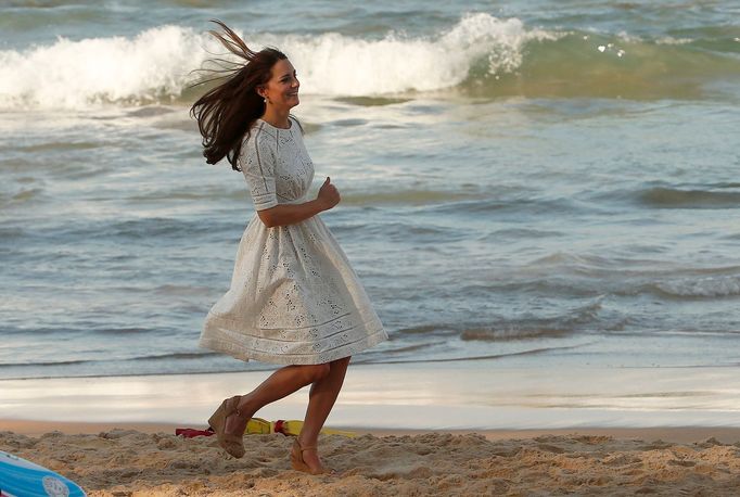 Catherine, Britain's Duchess of Cambridge, runs across Manly beach in Sydney