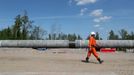 A worker walks near a pipe at the construction site of the Nord Stream 2 gas pipeline, near the town of Kingisepp, Leningrad region, Russia June 5, 2019. REUTERS/Anton Va