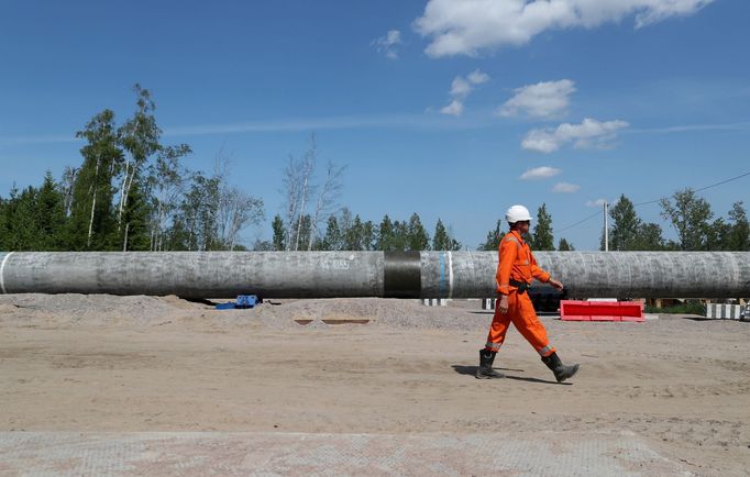 A worker walks near a pipe at the construction site of the Nord Stream 2 gas pipeline, near the town of Kingisepp, Leningrad region, Russia June 5, 2019. REUTERS/Anton Va