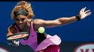 Serena Williams of the U.S. hits a return to Vesna Dolonc of Serbia during their women's singles match at the Australian Open 2014 tennis tournament in Melbourne January