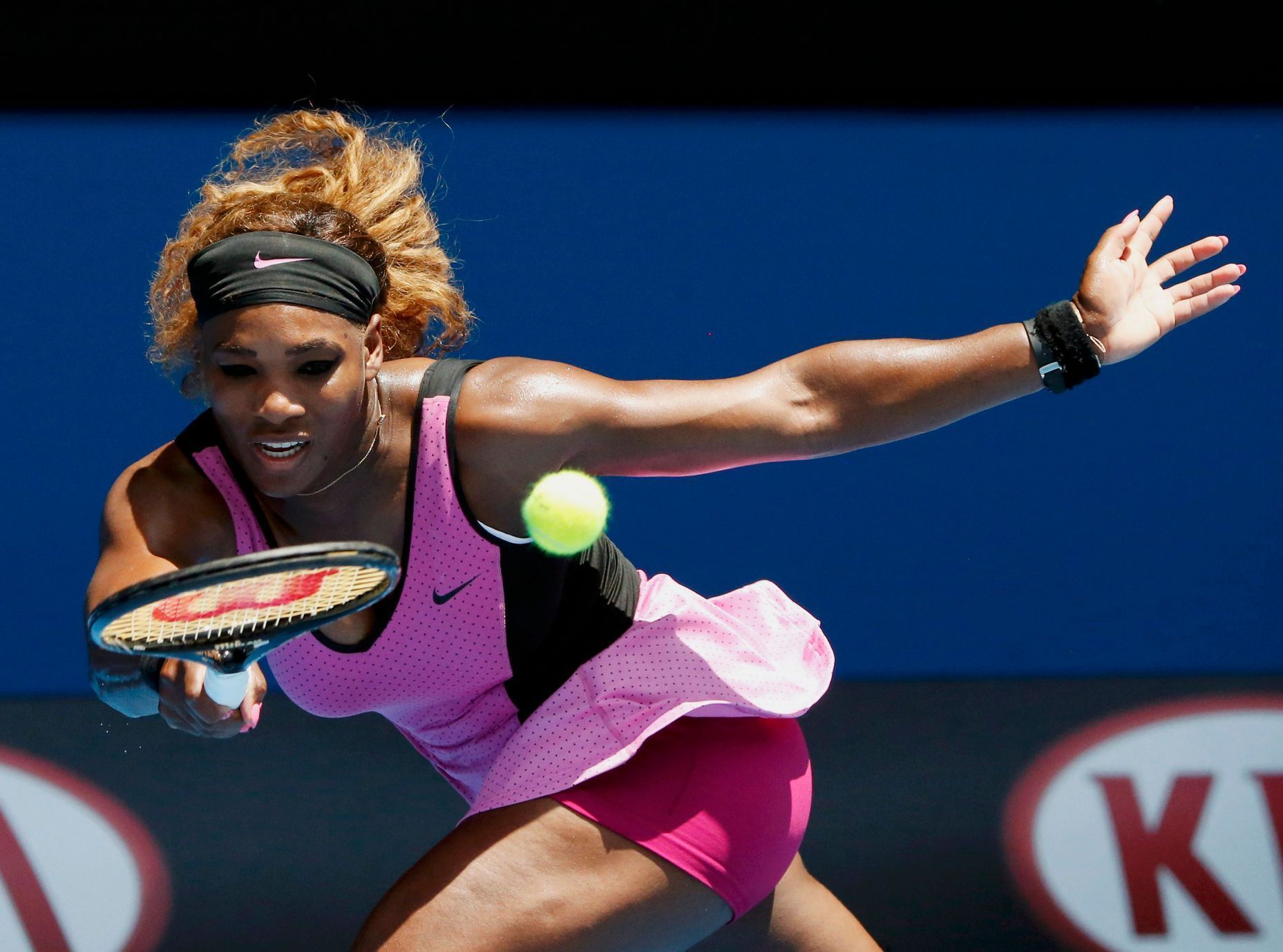 Serena Williams of the U.S. hits a return to Vesna Dolonc of Serbia during their women's singles match at the Australian Open 2014 tennis tournament in Melbourne