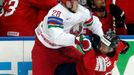 Switzerland's Blum collides with Koltsov of Belarus during the second period of their men's ice hockey World Championship group B game at Minsk Arena in Minsk