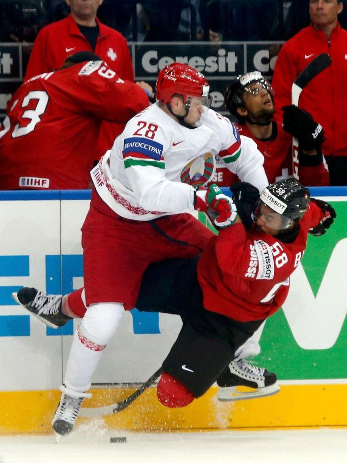 Switzerland's Blum collides with Koltsov of Belarus during the second period of their men's ice hockey World Championship group B game at Minsk Arena in Minsk