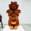 A man looks at a sculpture before the opening of a Jeff Koons retrospective at the Whitney Museum of American Art in New York