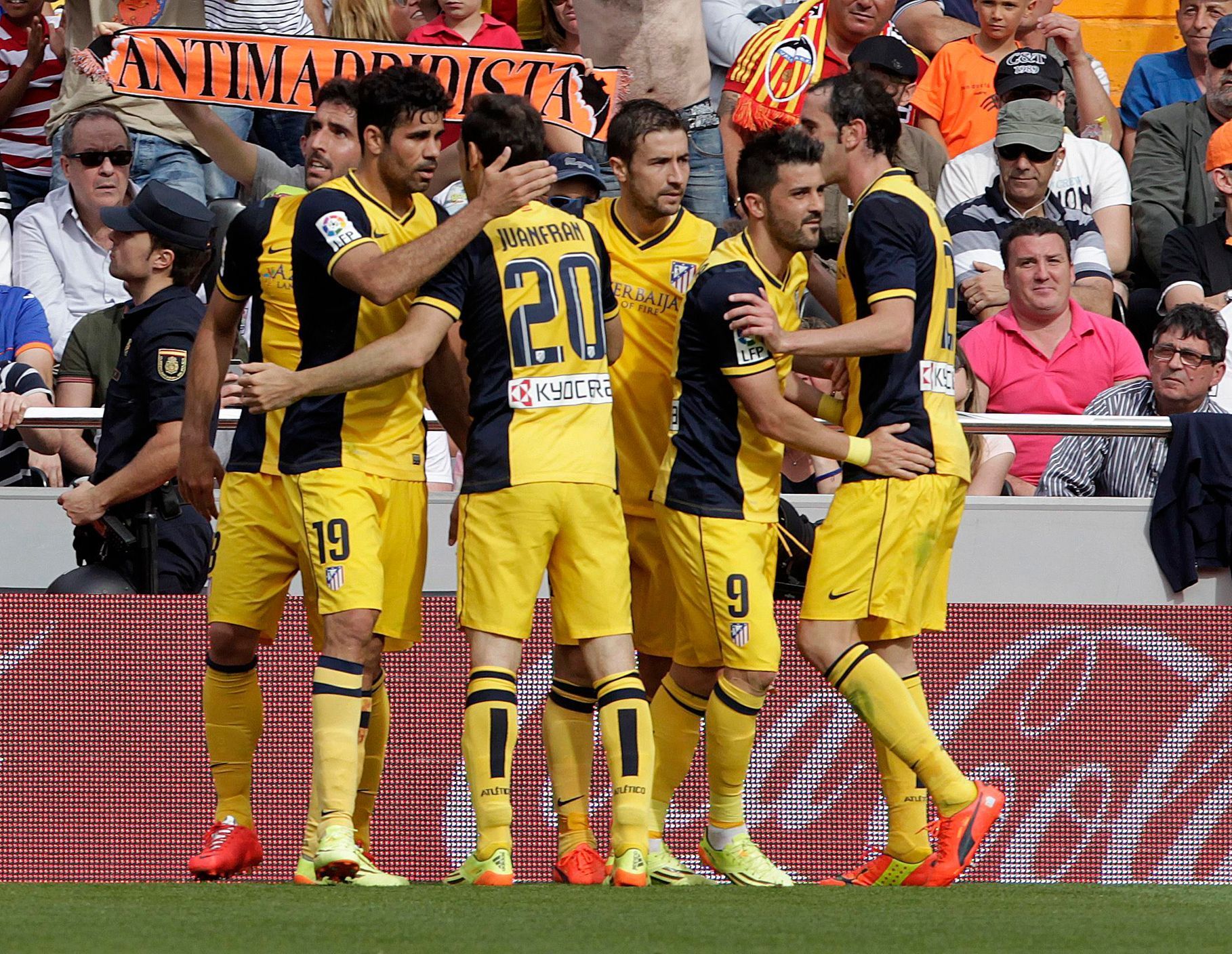 Atletico Madrid's players celebrate after they scored against Valencia during their Spanish first division soccer match in Valencia