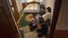 Anzor and Salakhutdin, students at the Russian Islamic University, pray in their flat in the Chechen capital Grozny April 23, 2013. The naming of two Chechens, Dzhokhar and Tamerlan Tsarnaev, as suspects in the Boston Marathon bombings has put Chechnya - the former site of a bloody separatist insurgency - back on the world's front pages. Chechnya appears almost miraculously reborn. The streets have been rebuilt. Walls riddled with bullet holes are long gone. New high rise buildings soar into the sky. Spotless playgrounds are packed with children. A giant marble mosque glimmers in the night. Yet, scratch the surface and the miracle is less impressive than it seems. Behind closed doors, people speak of a warped and oppressive place, run by a Kremlin-imposed leader through fear. Picture taken April 23, 2013. REUTERS/Maxim Shemetov (RUSSIA - Tags: SOCIETY POLITICS RELIGION EDUCATION) ATTENTION EDITORS: PICTURE 31 OF 40 FOR PACKAGE 'INSIDE MODERN CHECHNYA'. SEARCH 'REBUILDING CHECHNYA' FOR ALL IMAGES Published: Kvě. 1, 2013, 8:15 dop.