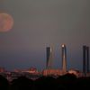 The Supermoon rises over the Four Towers Business Area in Madrid