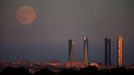 The Supermoon rises over the Four Towers Business Area in Madrid