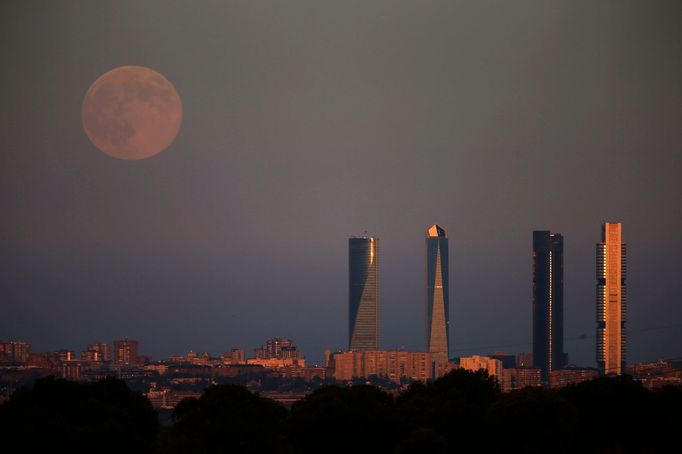 The Supermoon rises over the Four Towers Business Area in Madrid