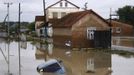 A car lies submerged in a flooded street in the village of Novoukrainsk, near the southern Russian town of Krymsk, July 7, 2012. At least 99 people were killed in floods and landslides in southern Russia after two months' average rainfall fell in a few hours overnight, police and emergency officials said on Saturday. REUTERS/VladimirAnosov (RUSSIA - Tags: DISASTER ENVIRONMENT TPX IMAGES OF THE DAY) Published: Čec. 7, 2012, 3:39 odp.