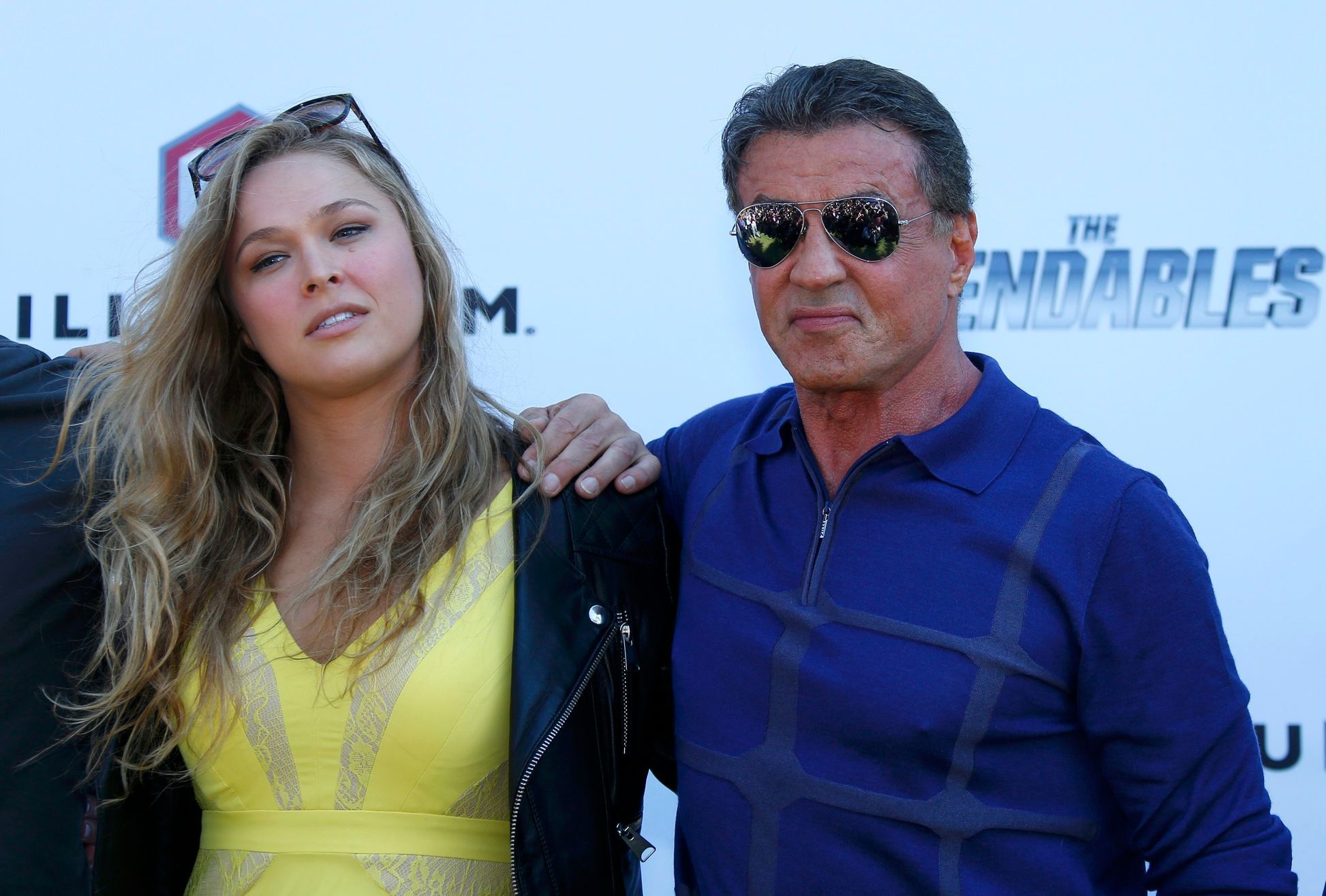 Cast members Ronda Rousey and Sylvester Stallone pose during a photocall on the Croisette to promote the film &quot;The Expendables 3&quot; during the 67th Cannes Film Festival in Cannes