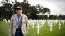 U.S WWII D-Day veteran Frank DeVita reacts as he stands among graves during a visit at Normandy American Cemetery and Memorial situated above Omaha Beach