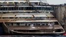 The bow of the Costa Concordia cruise liner is pictured from a ferry as it emerges during the refloating operation at Giglio harbour July 20, 2014.