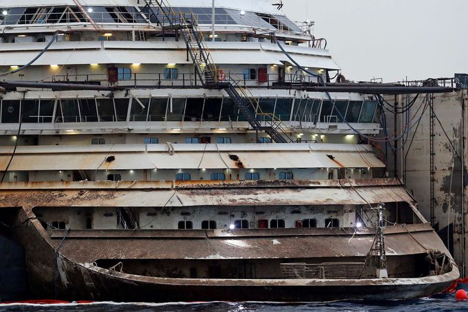 The bow of the Costa Concordia cruise liner is pictured from a ferry as it emerges during the refloating operation at Giglio harbour July 20, 2014.