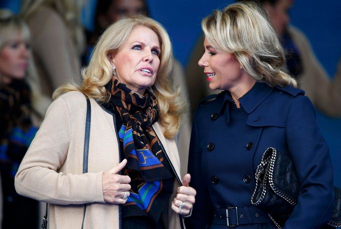 Alison McGinley wife of Team Europe captain Paul McGinley, and Hilary Watson wife of U.S. Team captain Tom Watson speak to each other during the opening ceremony of the 4