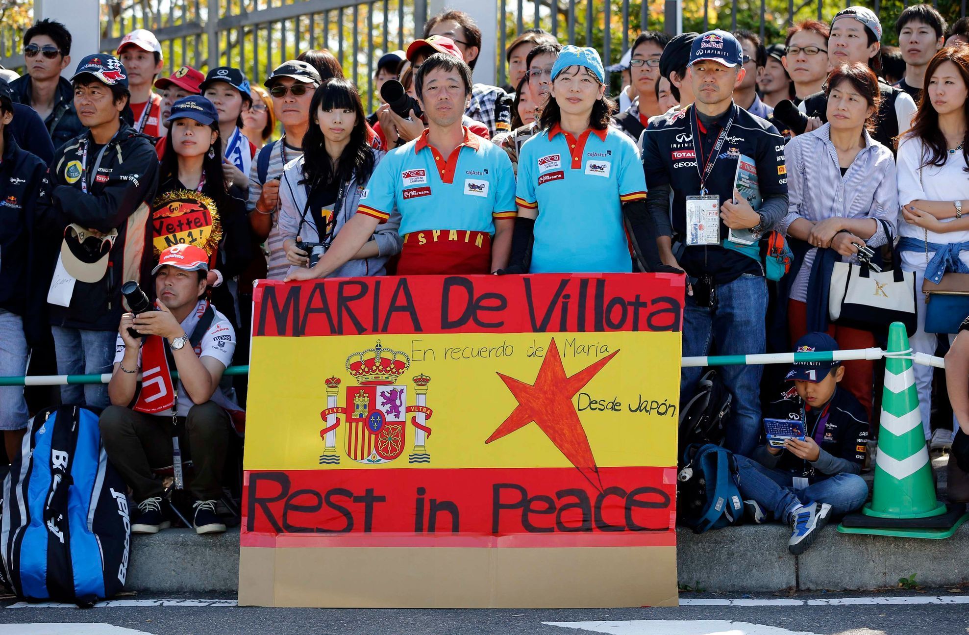 Japanese fans display a banner in colours of Spanish flag commemorating late Marussia test driver De Villota of Spain, at entrance to Suzuka circuit ahead of Japanese F1 Grand Prix