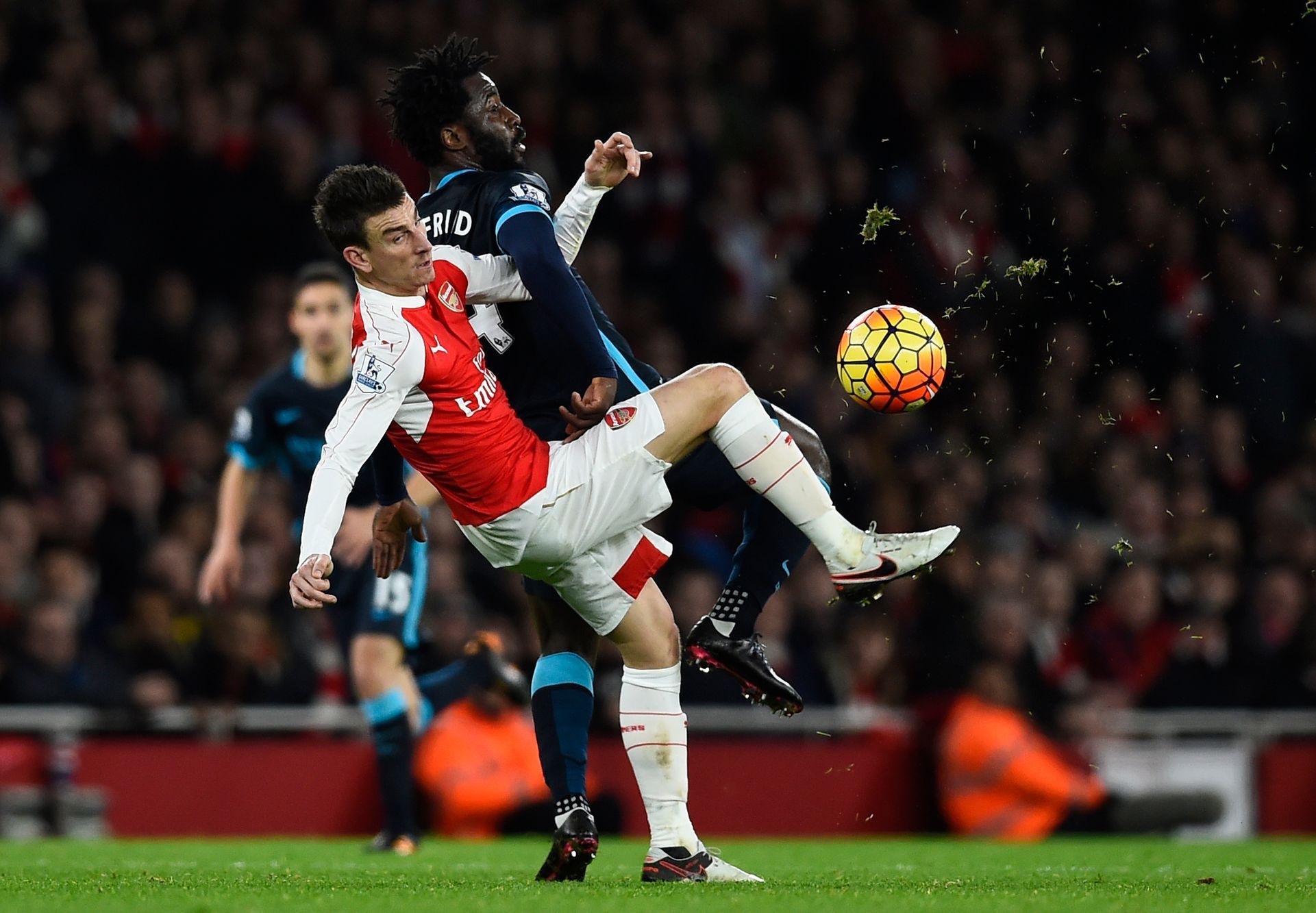 Manchester City's Wilfried Bony in action with Arsenal's Laurent Koscielny