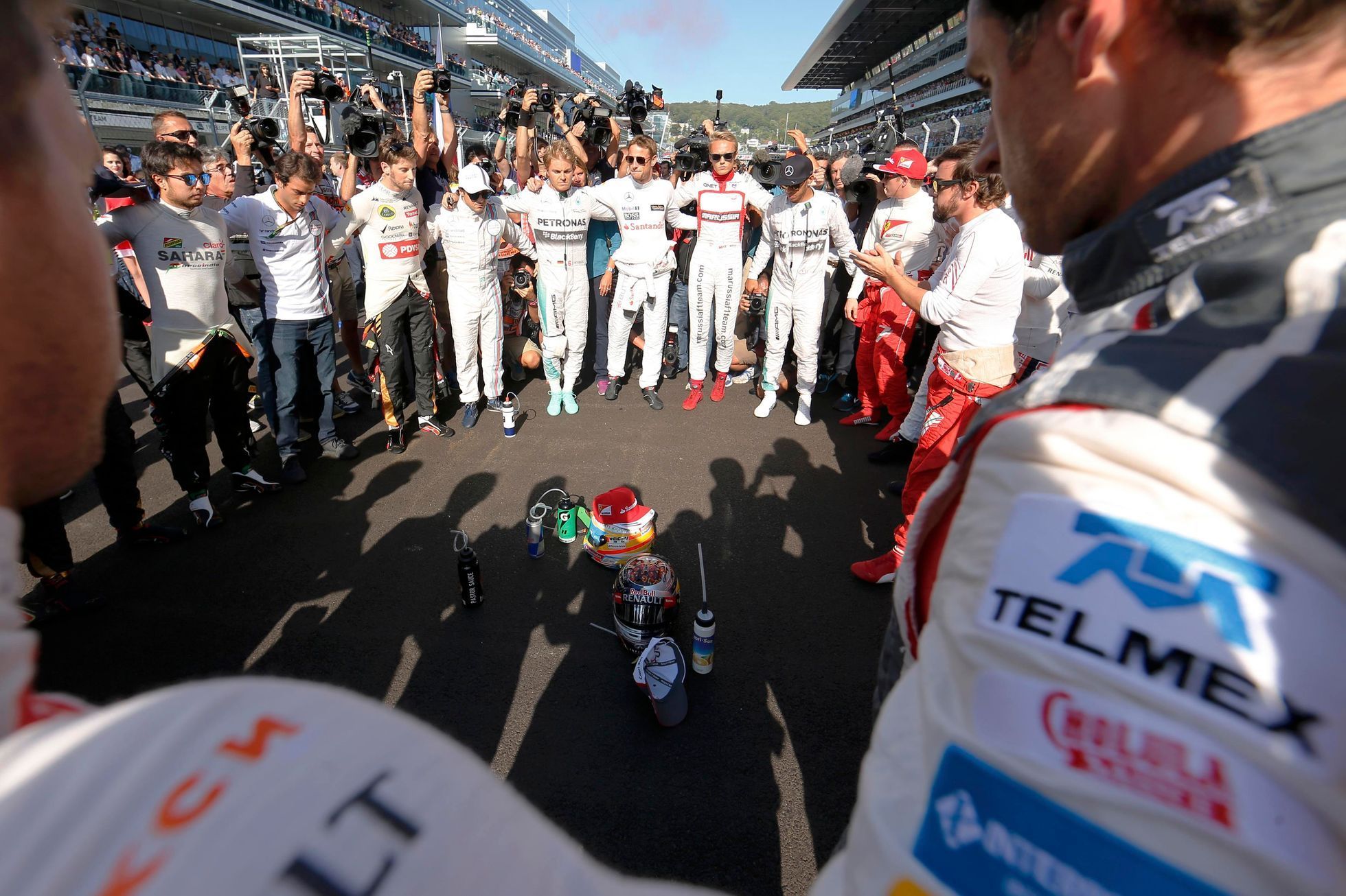 Formula One drivers pray for Marussia Formula One driver Bianchi of France who had an accident in the previous race, before the first Russian Grand Prix in Sochi