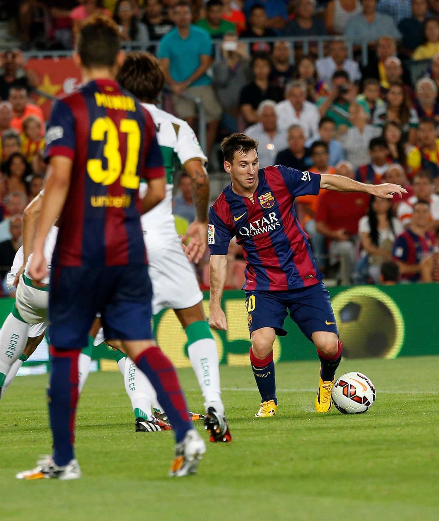 Barcelona's Lionel Messi scores his second goal  against Elche during their Spanish first division soccer match at Nou Camp stadium in Barcelona