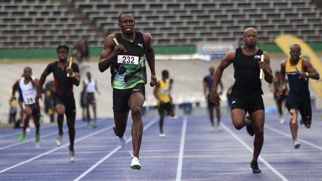 Jamaican runners Bolt and Powell compete in the men's 4x100m relay in Kingston