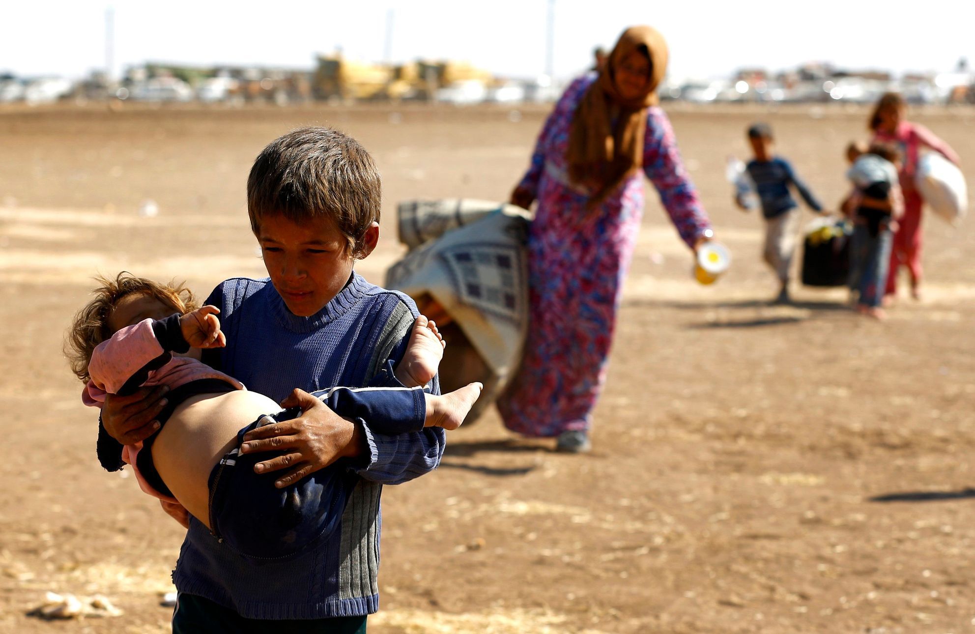 Kurdští uprchlíci na syrsko-turecké hranici.