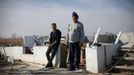 Kulib Abass, a New York City Cab driver, poses for a photograph with his son Hassan in the remains of his house on Kissam Avenue, Staten Island November 12, 2012. Abass's house was destroyed, along with most of the neighbourhood, by Hurricane Sandy. Just three years earlier, neighbours on this tight-knit seaside road had pulled together to survive a devastating Easter 2009 fire that damaged many of their homes. Most are now suddenly homeless like Abbas who said he would likely not return to rebuild on this low-lying part of Staten Island where he had hoped to spend his retirement years living by the shore. Picture taken November 12, 2012. REUTERS/Mike Segar (UNITED STATES - Tags: DISASTER ENVIRONMENT) ATTENTION EDITORS PICTURE 08 OF 19 FOR PACKAGE 'SURVIVING SANDY' SEARCH 'SEGAR SANDY' FOR ALL PICTURES Published: Lis. 20, 2012, 3:30 odp.