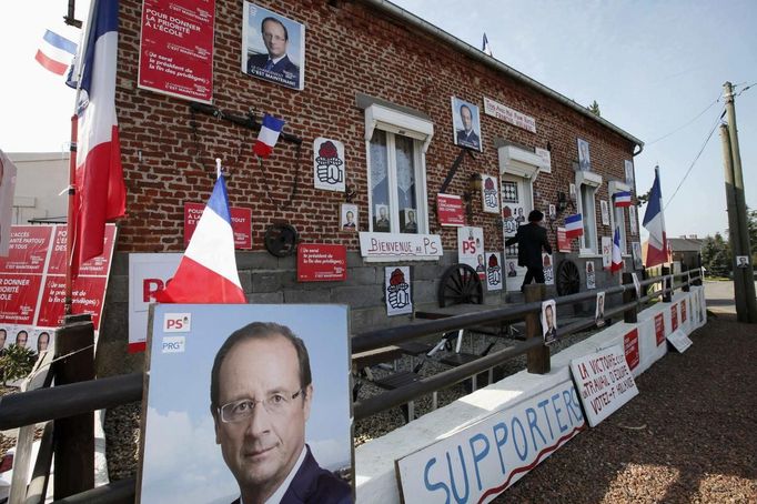 The house of Rocher, former mechanic and French Socialist party activist, poses is covered with posters and placards in support of Socialist party candidate Francois Hollande for the 2012 presidential election, in Ramousies