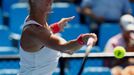 Mandy Minella of Luxembourg hits a return to Carina Witthoeft of Germany during their women's singles match at the Australian Open 2014 tennis tournament in Melbourne Jan