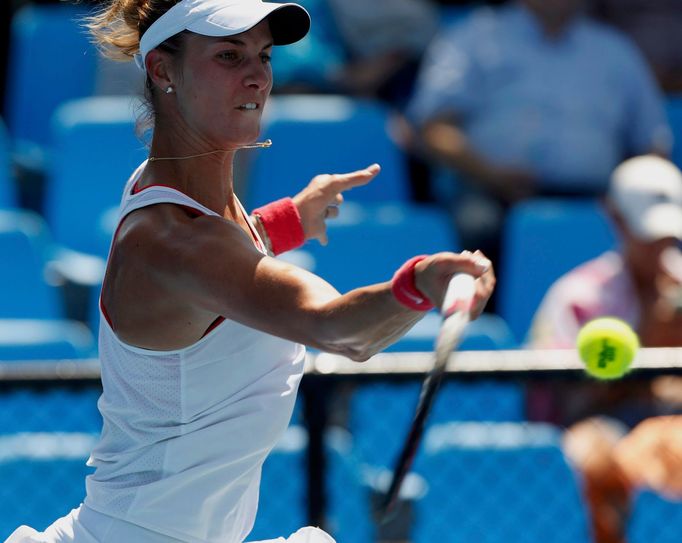 Mandy Minella of Luxembourg hits a return to Carina Witthoeft of Germany during their women's singles match at the Australian Open 2014 tennis tournament in Melbourne Jan