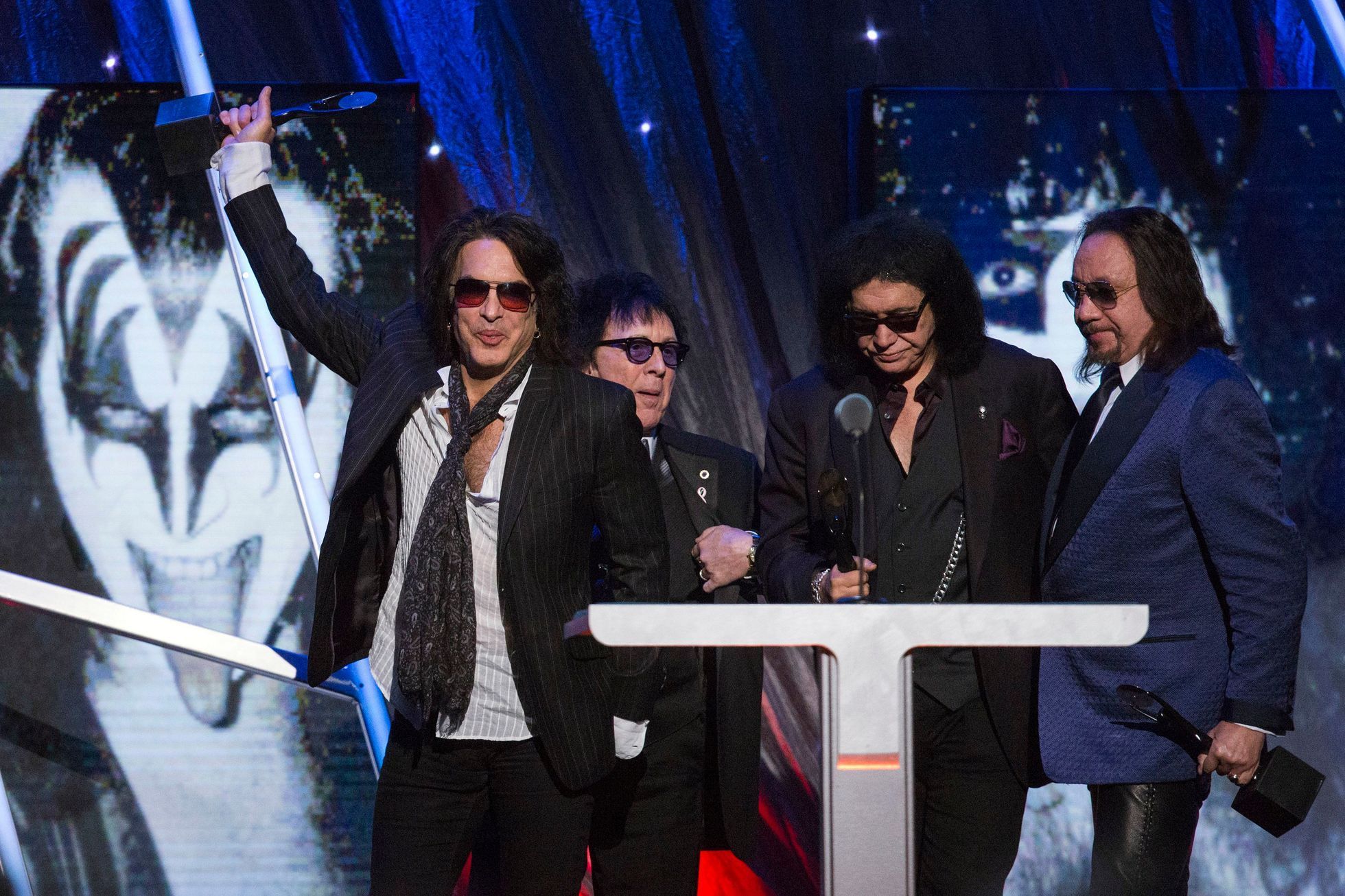 Kiss band member Stanley holds up their award after rock band was inducted at 29th annual Rock and Roll Hall of Fame Induction Ceremony in Brooklyn, New York
