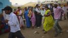 Relatives (R) of a devotee who is believed to be possessed by evil spirits hold her as she runs in a state of trance around the courtyard of Guru Deoji Maharaj temple during a ghost fair at Malajpur village in Betul district in the central Indian state of Madhya Pradesh January 27, 2013. People from across India come to this fair to be exorcised of �evil spirits�. They are usually brought by relatives and they are most often women. The exorcism involves running around the temple courtyard to make the 'ghost' weak then being beaten by a priest with a broom. Picture taken January 27, 2013. REUTERS/Danish Siddiqui (INDIA - Tags: SOCIETY RELIGION) ATTENTION EDITORS: PICTURE 8 OF 24 FOR PACKAGE 'INDIAN GHOSTBUSTERS' SEARCH 'INDIA GHOST' FOR ALL IMAGES Published: Úno. 5, 2013, 5:09 dop.