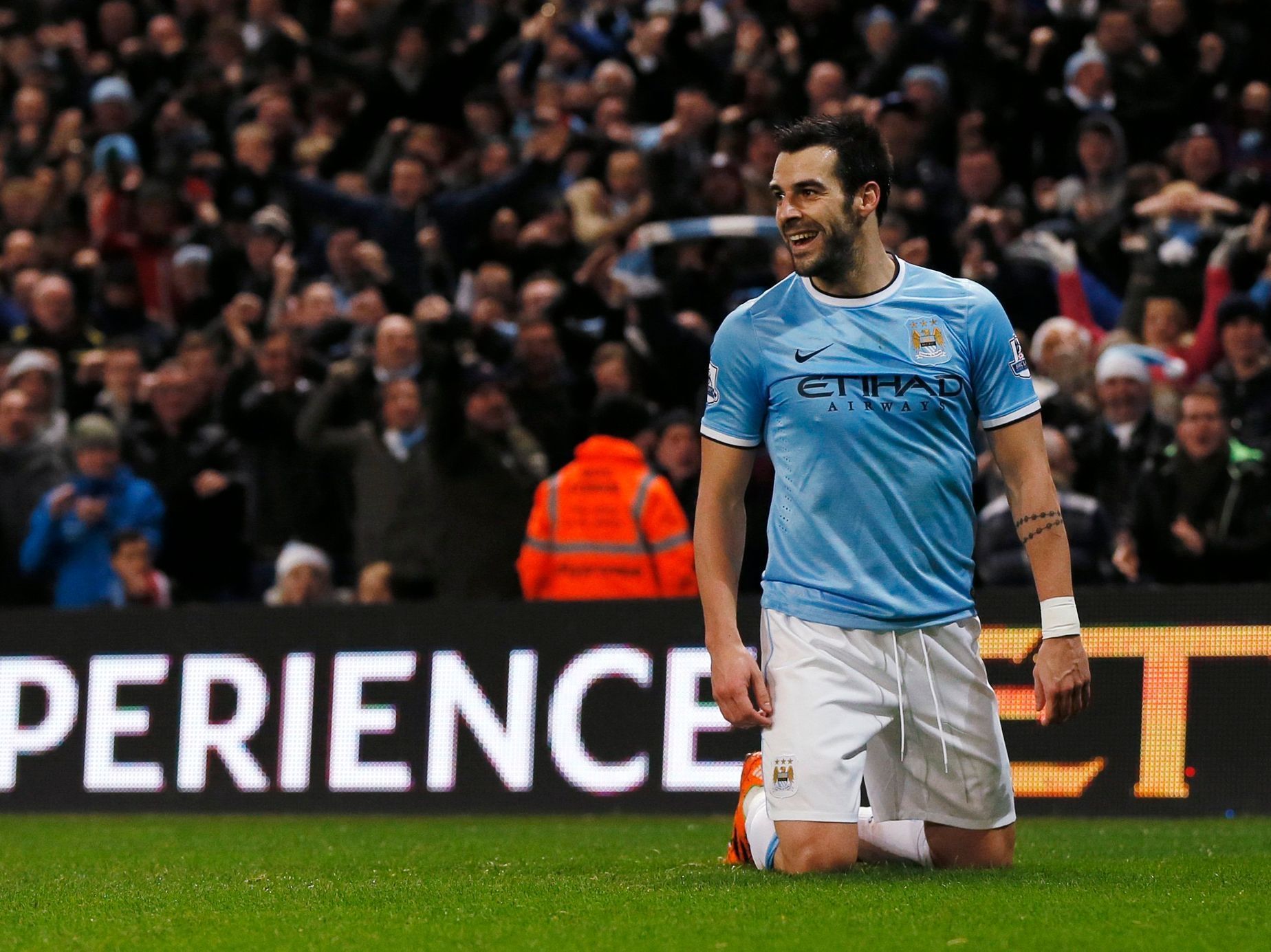Manchester City's Negredo celebrates after scoring a goal against Liverpool during their English Premier League soccer match in Manchester