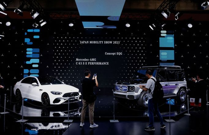 People take photos at the Mercedes-Benz booth during a press day of the Japan Mobility Show 2023 at Tokyo Big Sight in Tokyo, Japan October 25, 2023.  REUTERS/Issei Kato