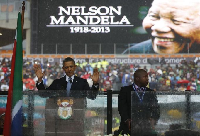 U.S. President Barack Obama addresses the crowd during a memorial service for Nelson Mandela at FNB Stadium in Johannesburg, South Africa December 10, 2013.