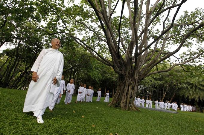 Buddhist nun walks in line with novice Thai nuns at the Sathira Dammasathan Buddhist meditation centre in Bangkok