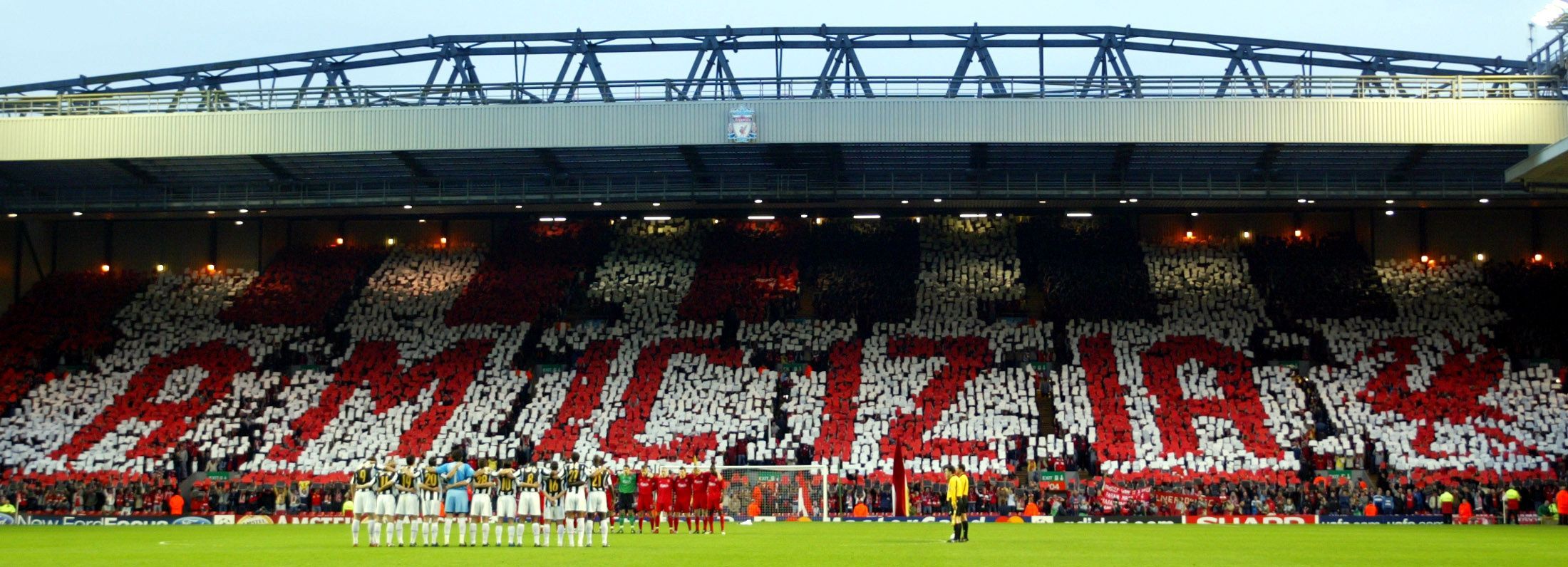 Liverpool supporters hold up a banner paying homage to the 39 fans killed during the Heysel Stadium disaster in 1985 ahead of the first-leg of their Champions League quarter-final against Juventus.