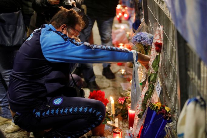 A man reacts as people gather to mourn the death of Argentine soccer legend Diego Maradona outside San Paolo stadium in Naples, Italy, November 25, 2020. REUTERS/Ciro De