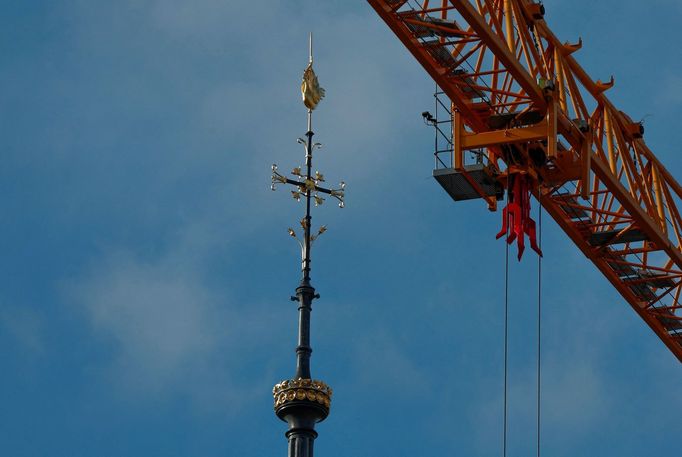 The spire, surmounted by a rooster and a cross, of the Notre-Dame de Paris Cathedral, which was ravaged by a fire in 2019, is pictured as restoration works continue, in P