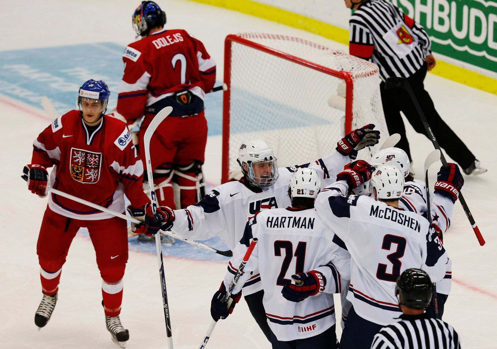 Team USA's players celebrate a goal in front of Czech Republic's Sulak and Dolejs during their IIHF World Junior Championship ice hockey game in Malmo