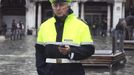 A local police official patrol at the flooded St. Mark square during a period of seasonal high water in Venice November 1, 2012. The water level in the canal city rose to 140 cm (55 inches) above normal, according to the monitoring institute. REUTERS/Manuel Silvestri (ITALY - Tags: ENVIRONMENT SOCIETY) Published: Lis. 1, 2012, 1:21 odp.