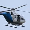 A police sniper sits in helicopter above scene of shooting rampage in Munich